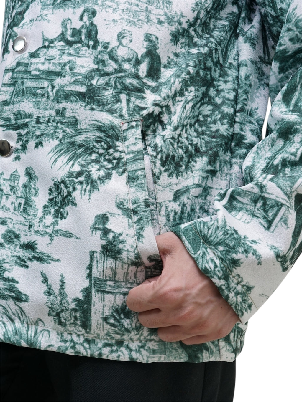 Green and white patterned jacket with a person holding it