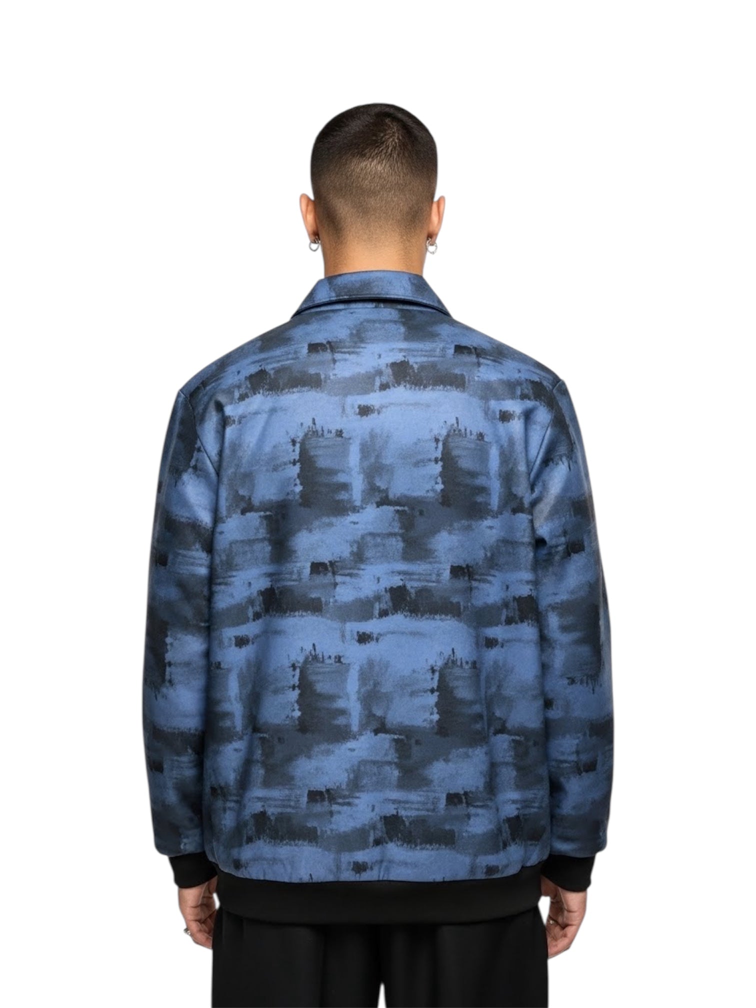 Person wearing a blue camouflage jacket back pose