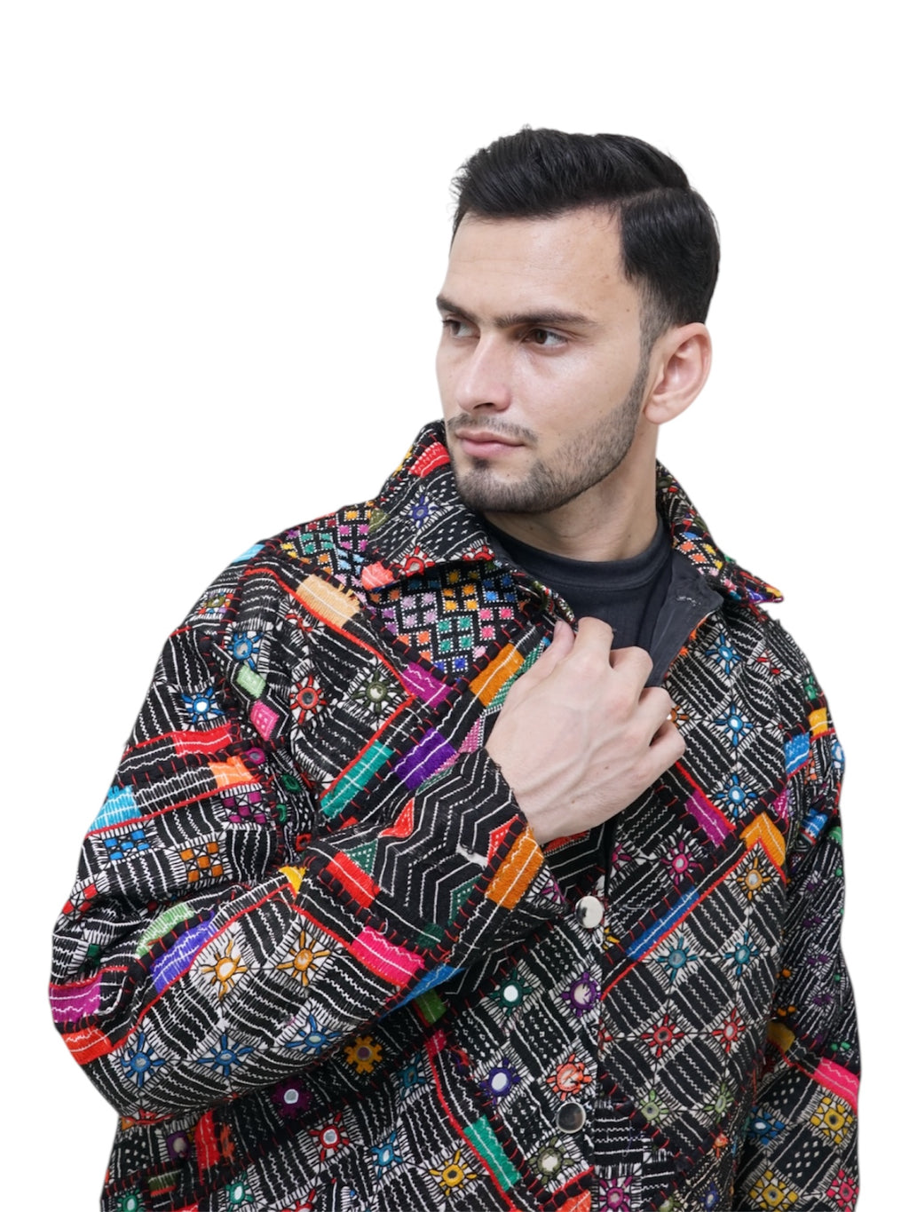 Man wearing a colorful patterned jacket on a white background